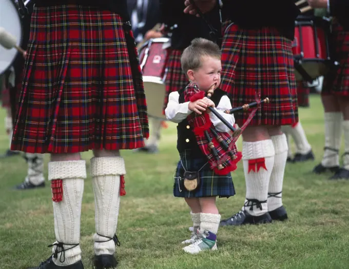 Boy standing with a bagpipe, Highland Games, Highlands, Scotland