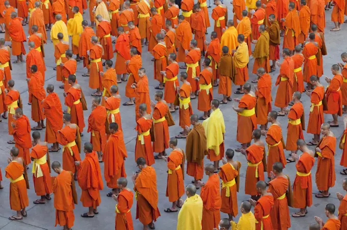 Monks praying outside a temple, Wat Phra Singh, Chiang Mai, Thailand