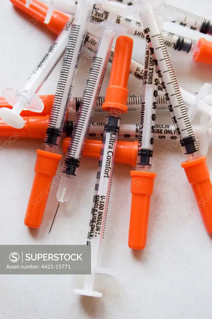 Insulin injections for diabetic pet cat, pile of syringes