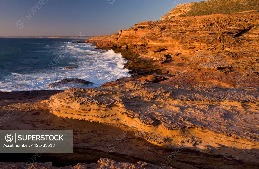 Sandstone cliffs (Tumblagooda sandstone) with limestone capping in evening, Pot Alley, Kalbarri Kalbarri N.P., Western Australia, Australia