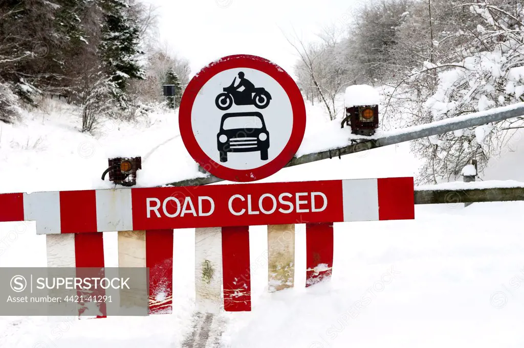 Road Closed sign on closed road snowgates because of severe