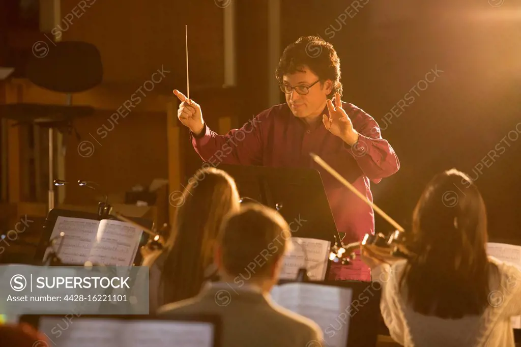 Conductor leading orchestra