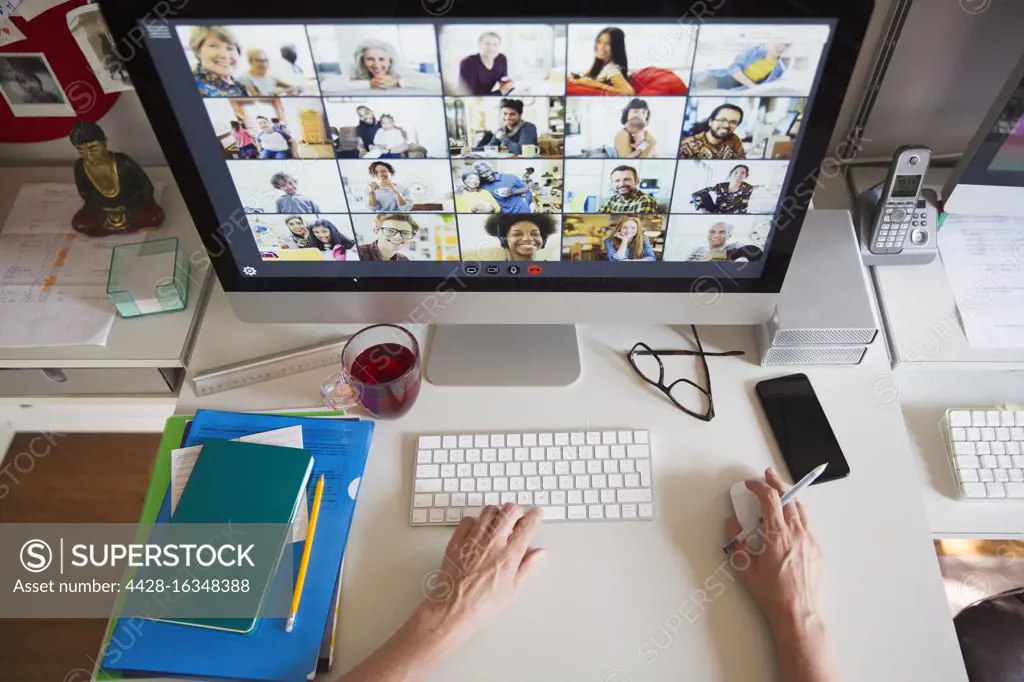 Colleagues video conferencing on computer screen