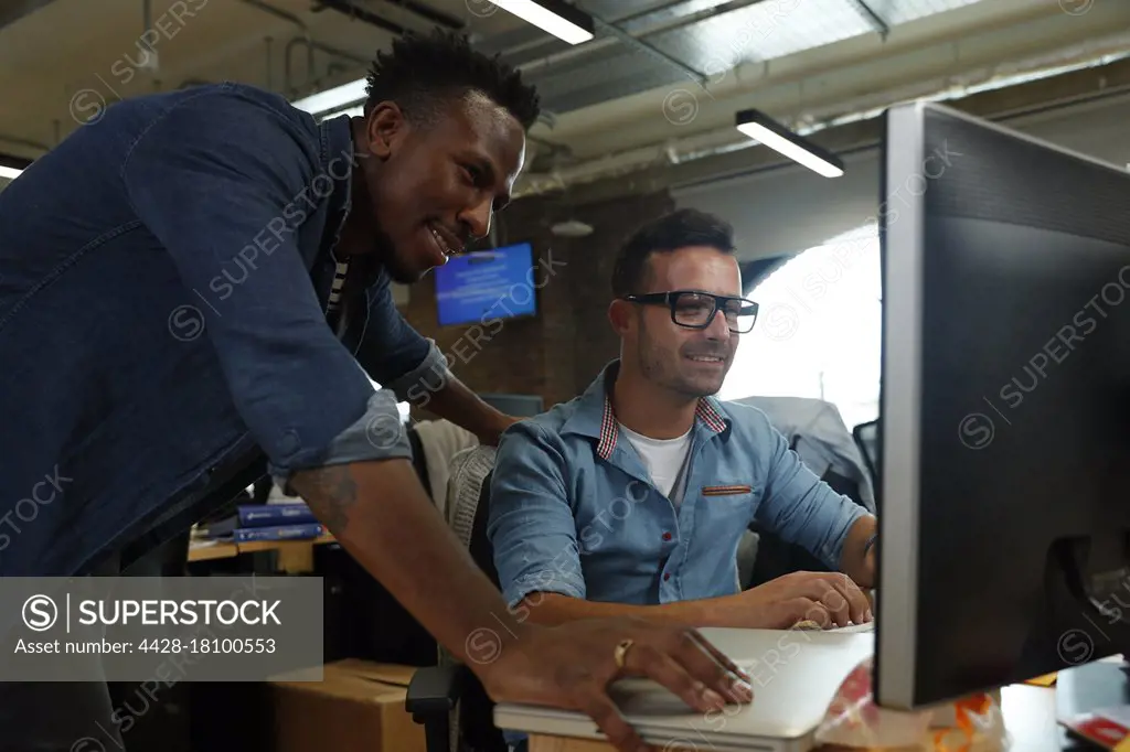 Businessmen working at computer in office