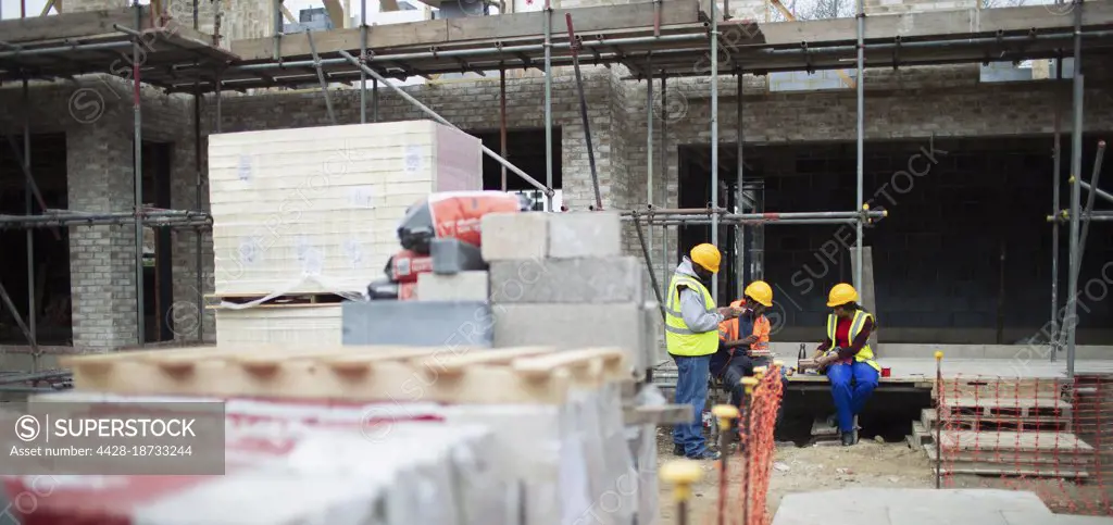 Construction workers on lunch break at construction site