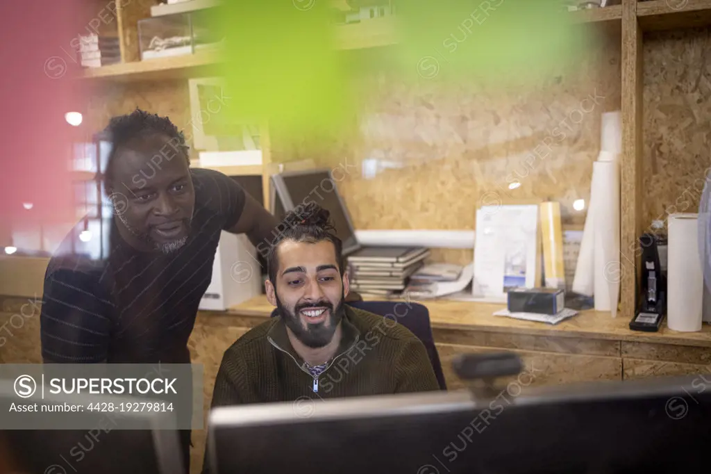 Businessmen working at computer in office