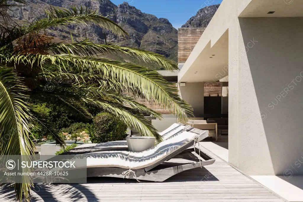 Lounge chairs outside modern house