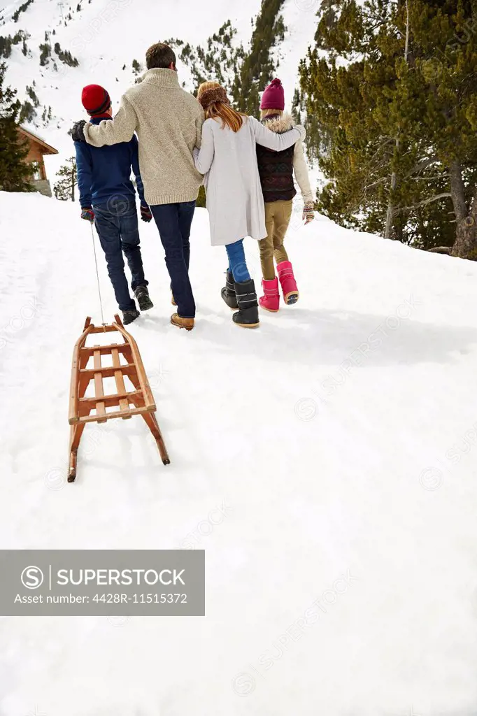 Family walking in snow together