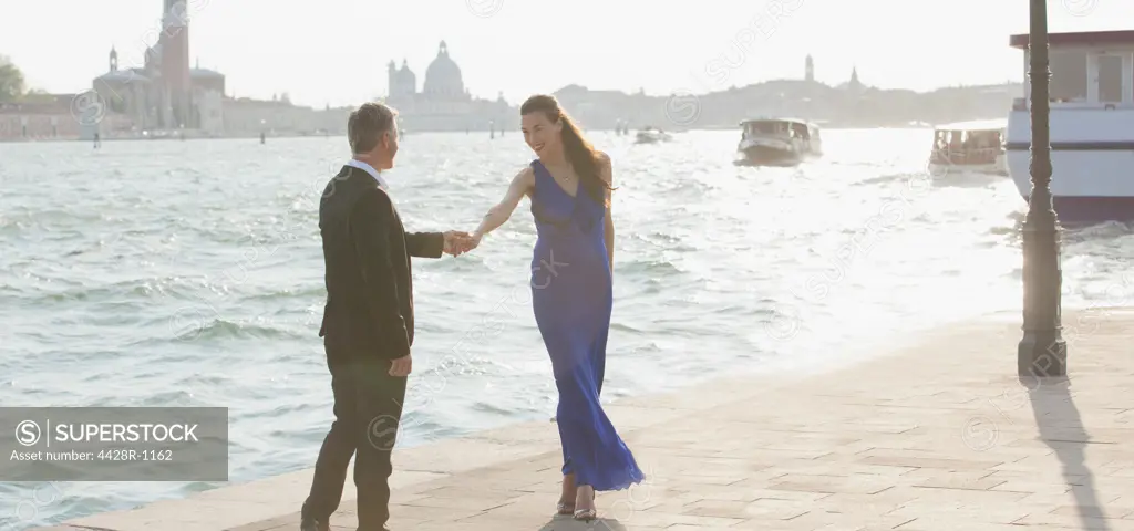 Venice, Well-dressed man and woman at waterfront in Venice