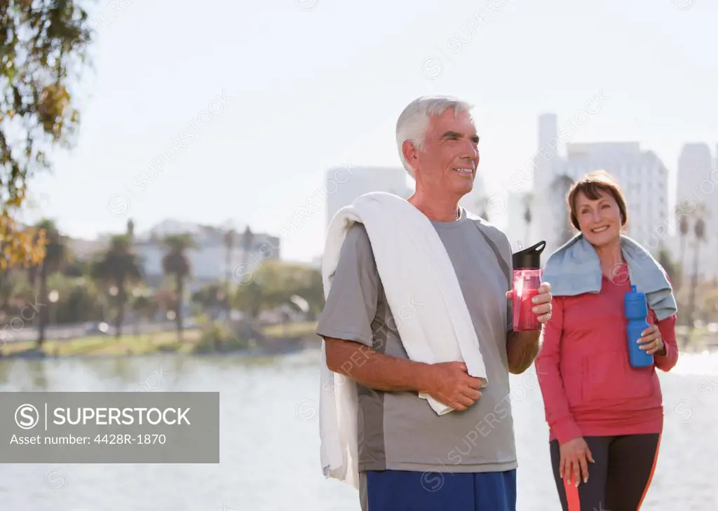 Los Angeles, USA, Older couple drinking water after workout