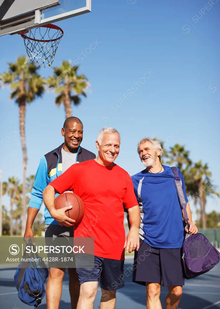 Los Angeles, USA, Older men playing basketball on court