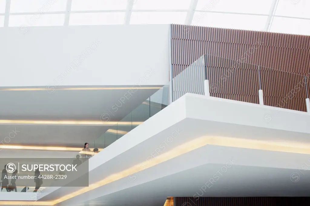 Spain, Business people with suitcases on elevated walkway