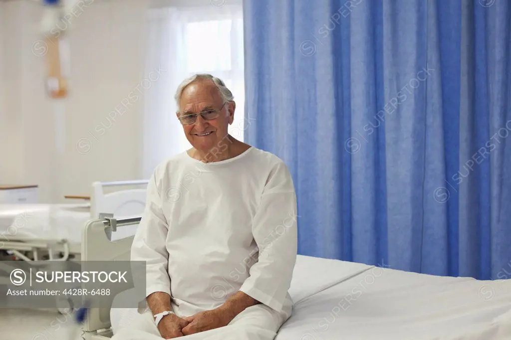 Older patient sitting on hospital bed