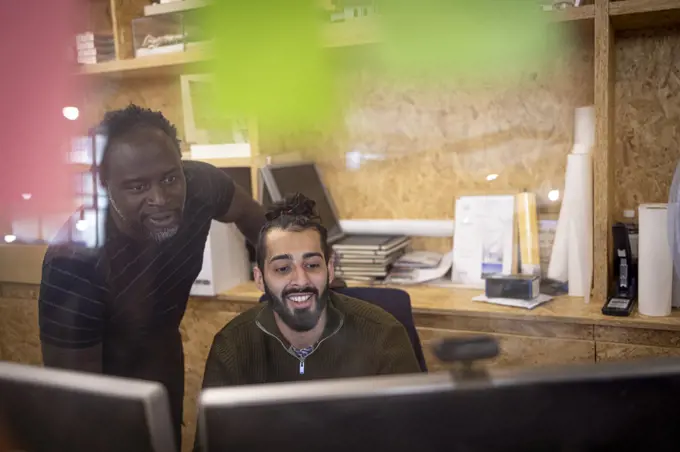 Businessmen working at computer in office