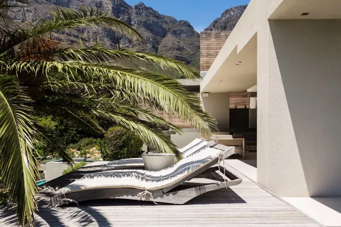 Lounge chairs outside modern house