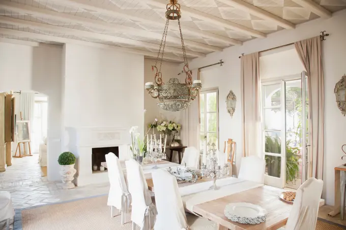 Spain, Chandelier over dining table in luxury dining room