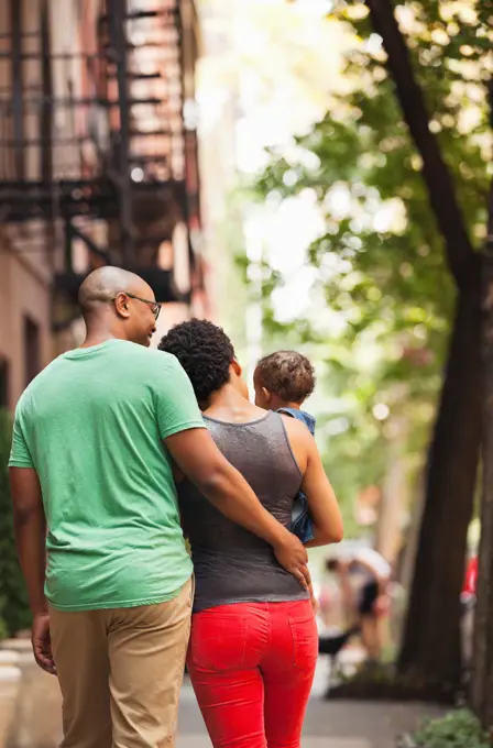 Family walking together on city street,New York