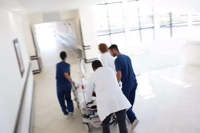 Hospital staff rushing patient to operating room