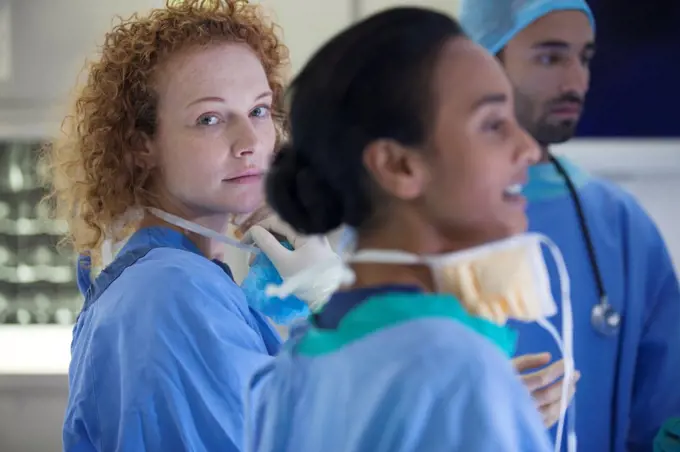 Surgeons standing in operating room