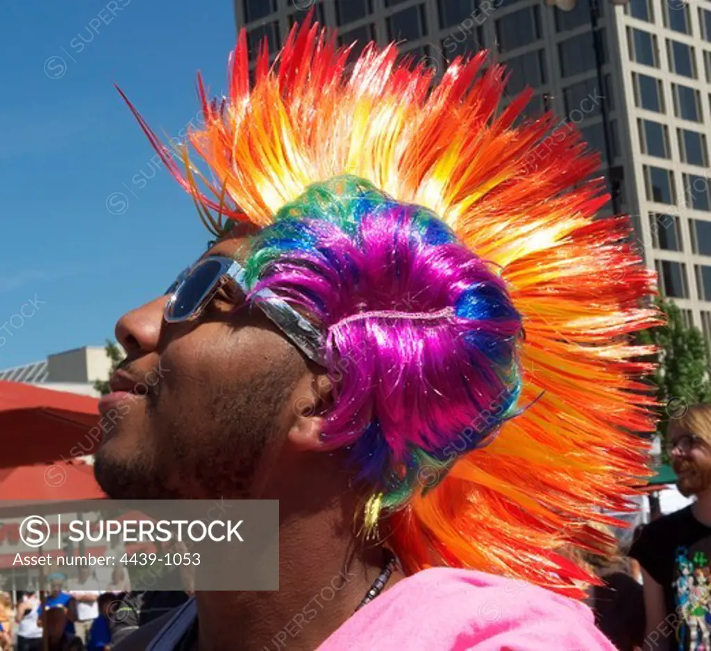 Gay man wearing rainbow colored wig at Worcester Gay Pride, Worcester, Massachusetts, USA