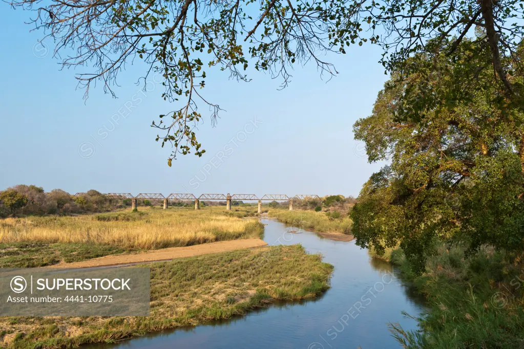 View of Sabi (Sabie) River at Skukuza Camp showing the Selati Railway Bridge which crosses the Sabie River. Kruger National Park. Mpumalanga. South Africa.