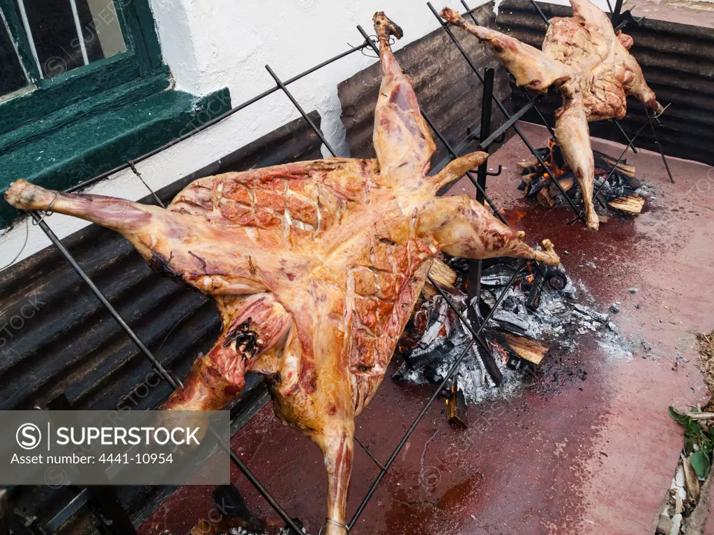 Karoo lam on a spit braai (barbecue) Richmond. Central Karoo region of the Northern Cape Province. South Africa.