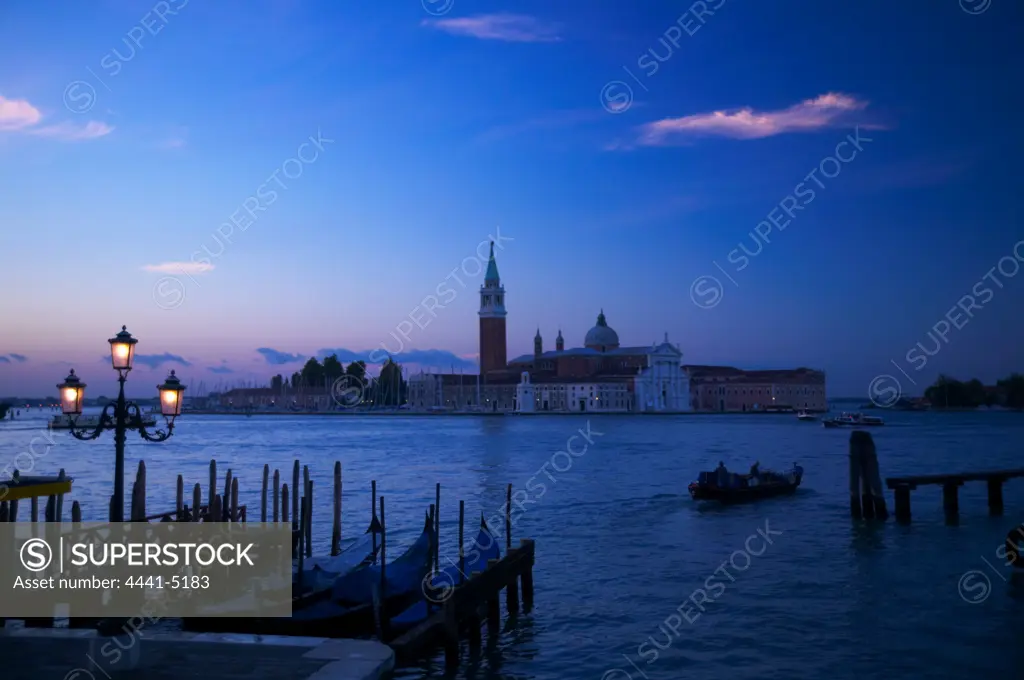 Gondelas and Church of St George (Chiesa di San Giorgio) on the Canal Grande (Grand Canal). Venice. Italy