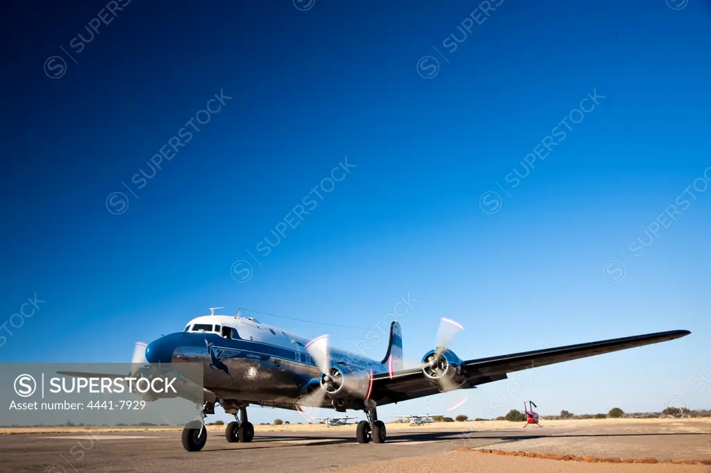 South African Airways aeroplane Douglas DC-4 1009 ZS-BMH at Limpopo Valley Airfield. Northern Tuli Game Reserve.  Botswana