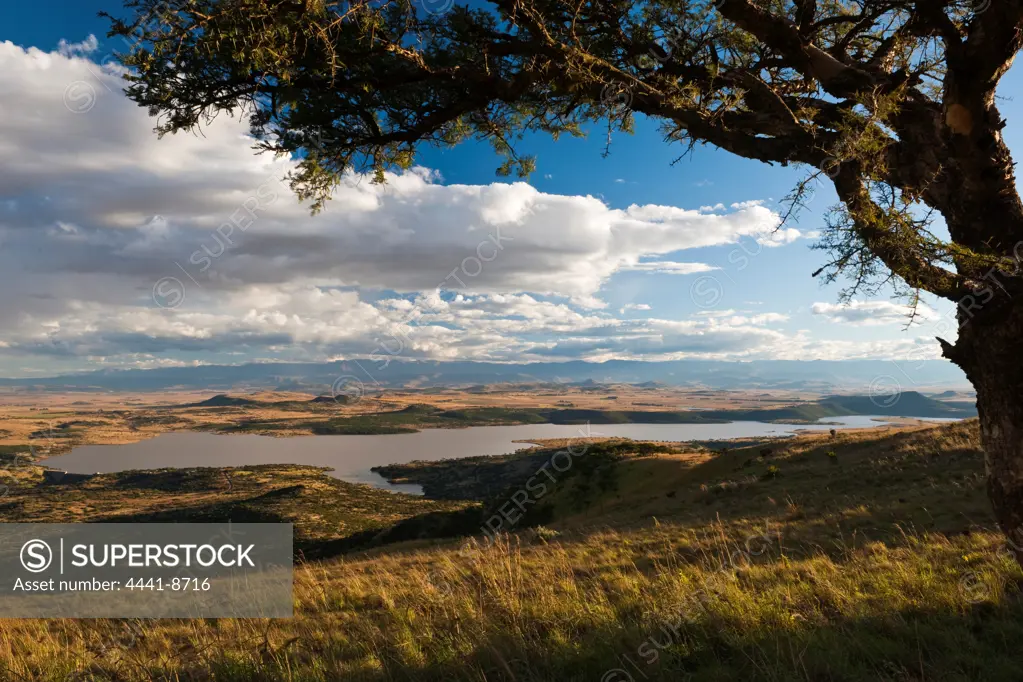 Spioenkop Battlefield with Spioenkop Dam and the Ukhahlamba Drakensberg Park in the background. Near Winterton. KwaZulu Natal. South Africa