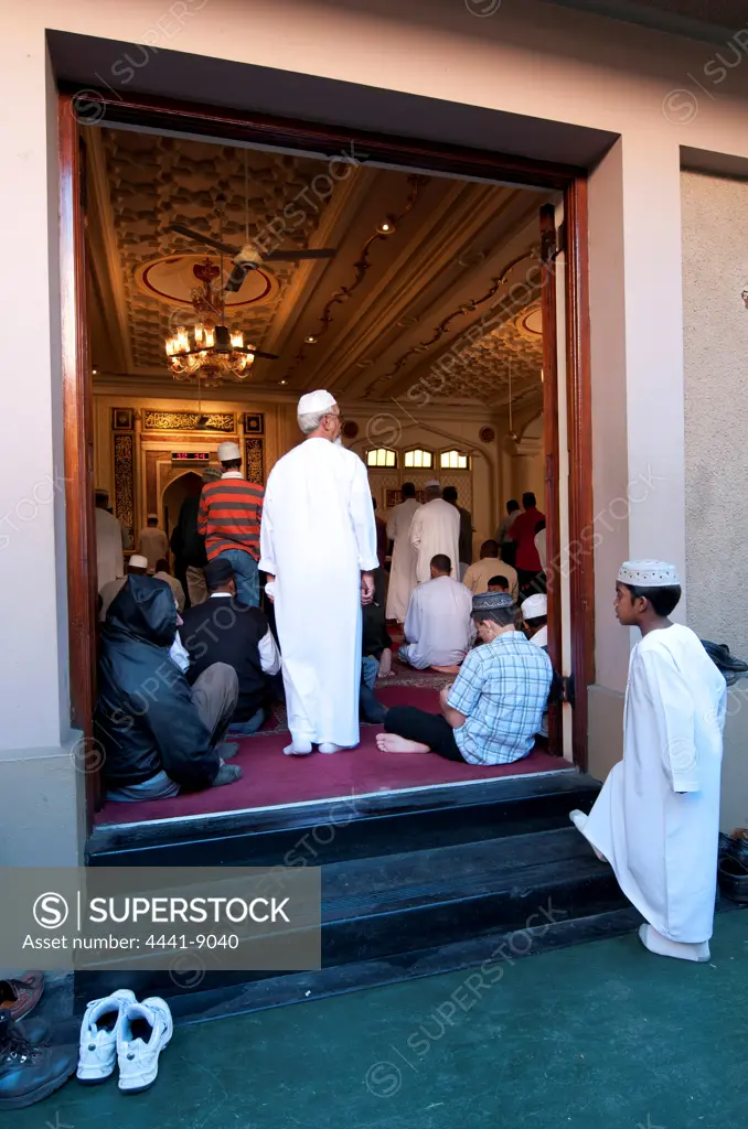 Men gathering for prayers on Friday. Juma Masjid Mosque, the largest mosque in the Southern hemisphere, on Grey Street. Durban. KwaZulu Natal. South Africa.