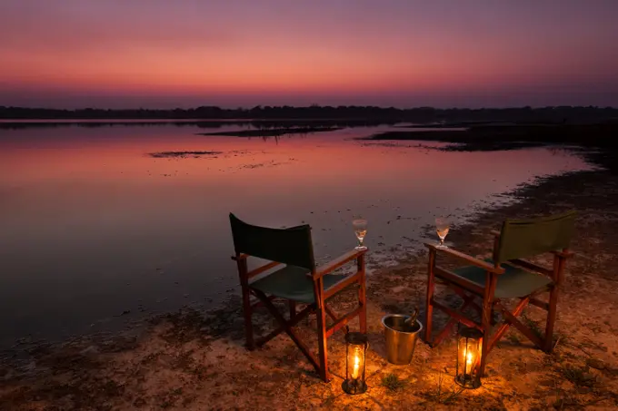 Tourists (guests) having sundowners on the shores of Lake Kushengeza (Shengeza) at Kosi Forest Lodge. Isimangaliso Wetland Park (Greater St Lucia Wetland Park. Manguzi (Kwangwanase). Maputaland. KwaZulu Natal. South Africa.