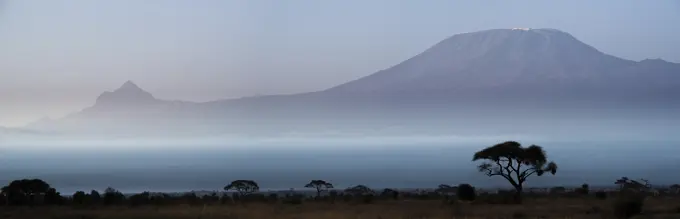 Mount (Mt) Kiliminjaro and Mount (MT)  Mawenzi on the left (in Tanzania) from Amboseli National Park. Kenya.