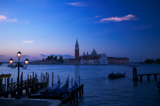 Gondelas and Church of St George (Chiesa di San Giorgio) on the Canal Grande (Grand Canal). Venice. Italy