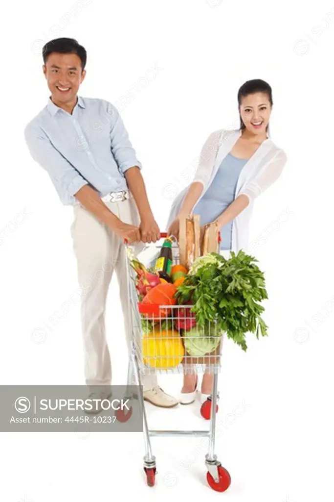 Young couple shopping with shopping cart