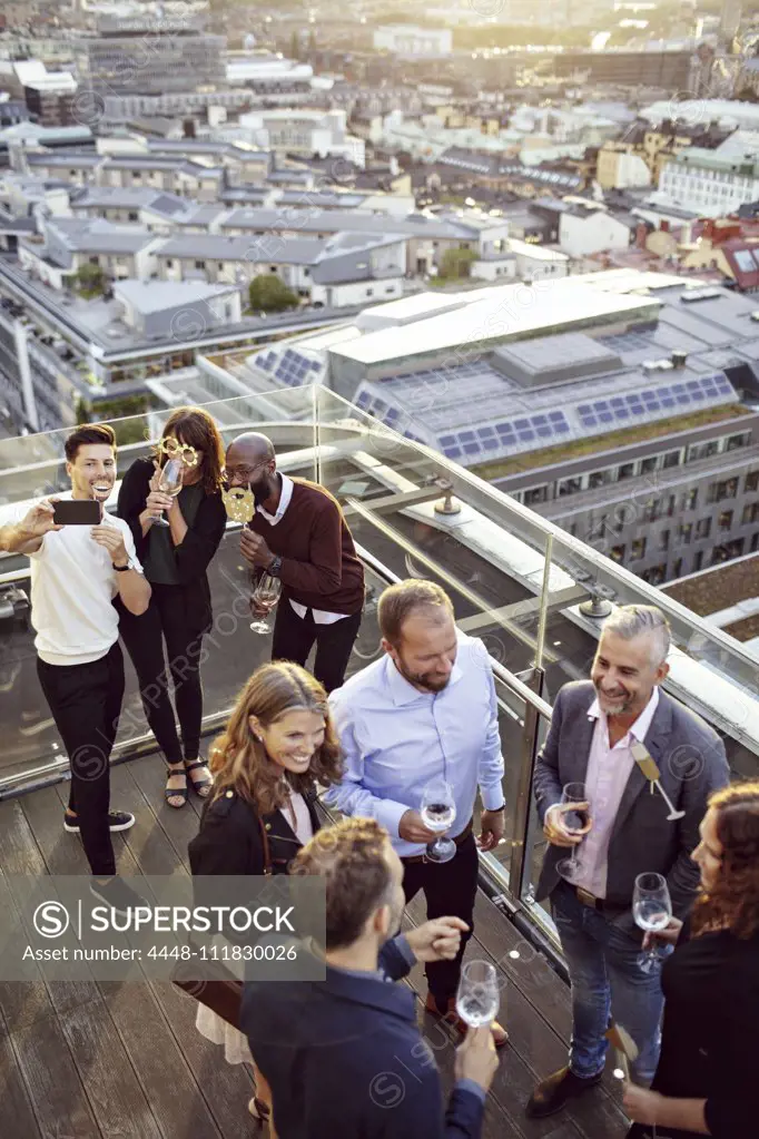 High angle view of business coworkers enjoying at office party after work