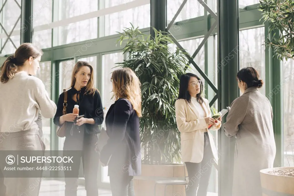 Multi-ethnic businesswomen networking in conference event