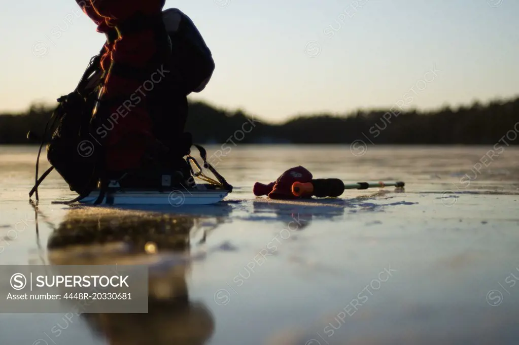 Close-up of ice-skater on lake