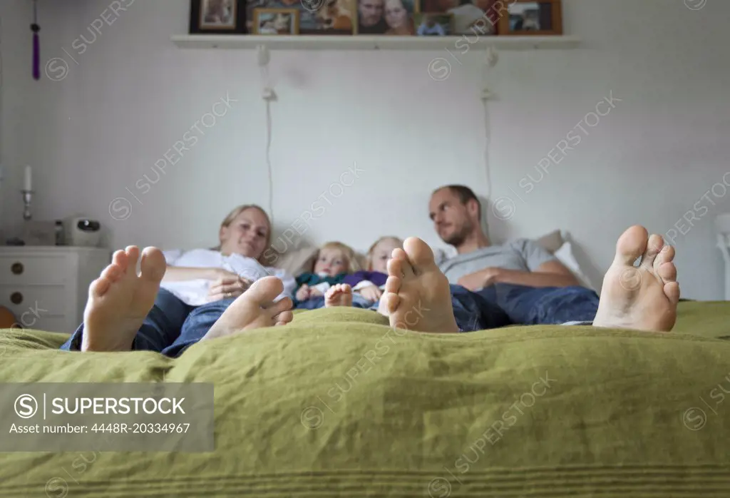 Family in green bed