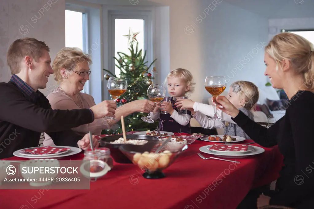 Family having a drink at dinner table