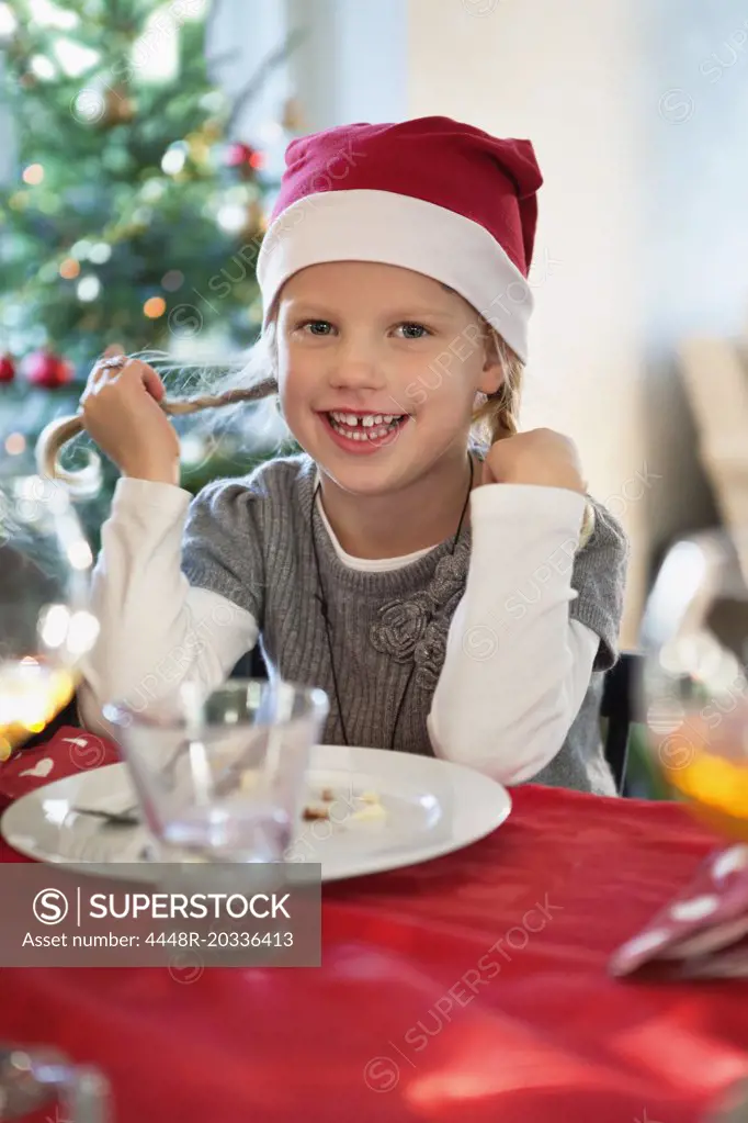 Happy girl with christmas hat