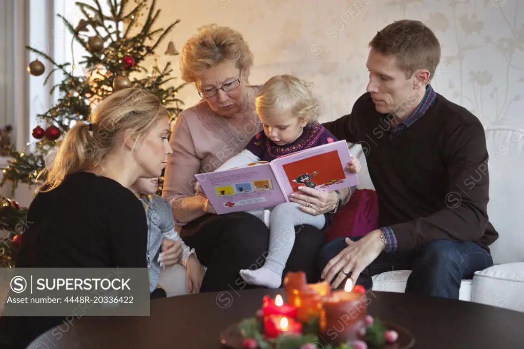 Family readig a book