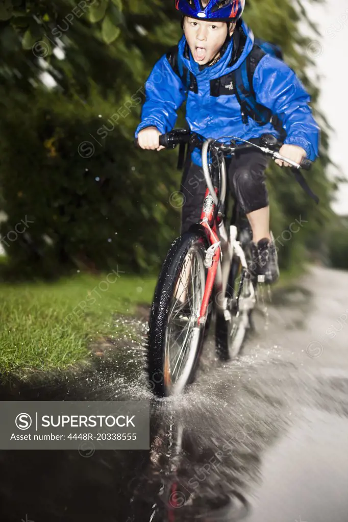 Full length of boy enjoying his cycle ride