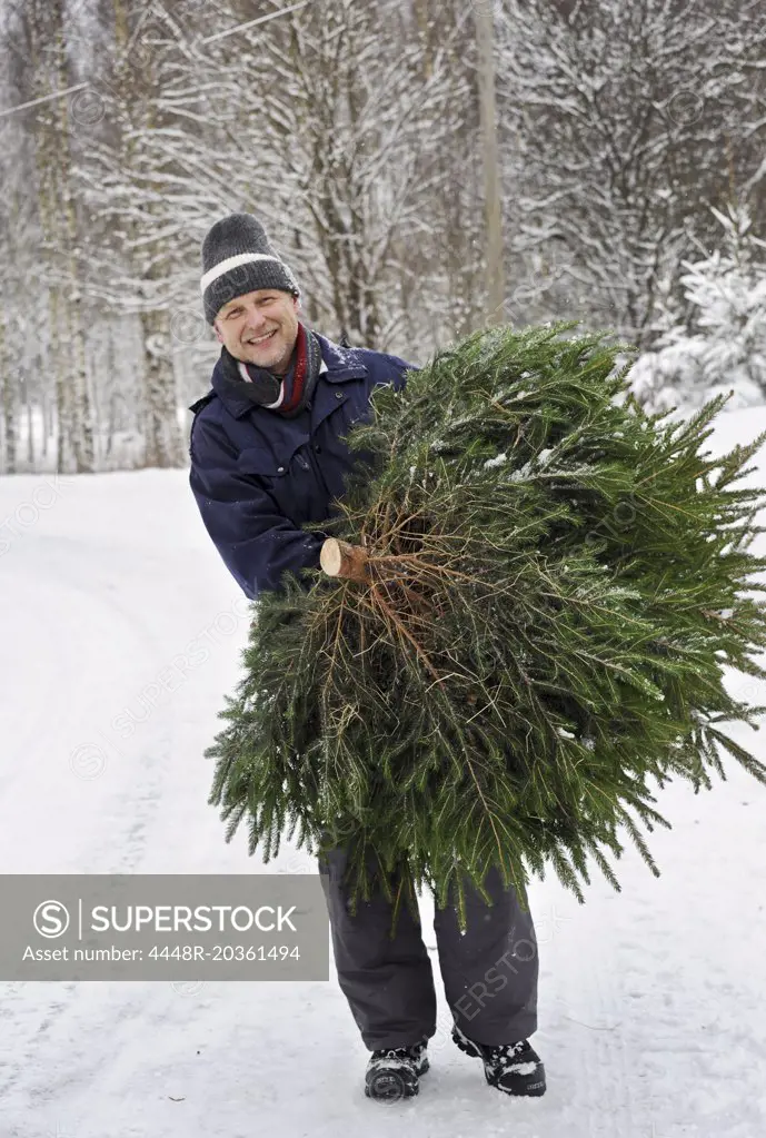 Man with christmas tree