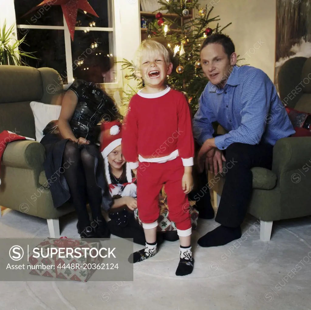 Boy in santa suit screaming