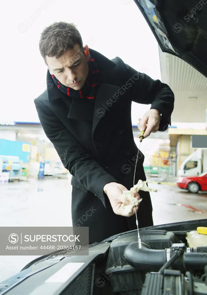 Man checking oil level