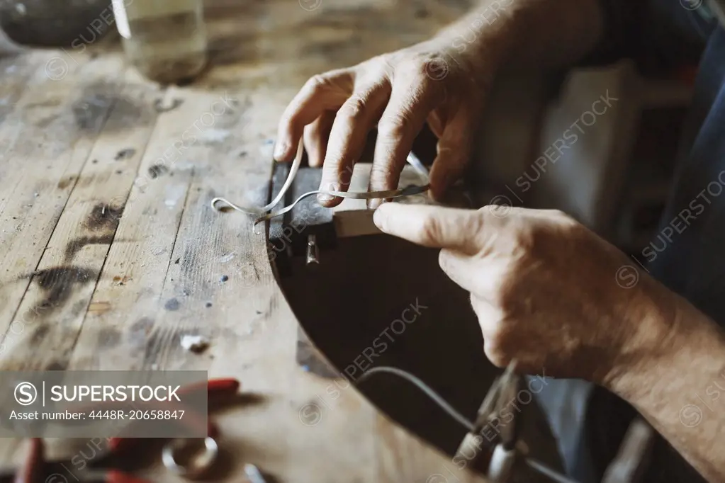 Cropped image of craftsman working in workshop