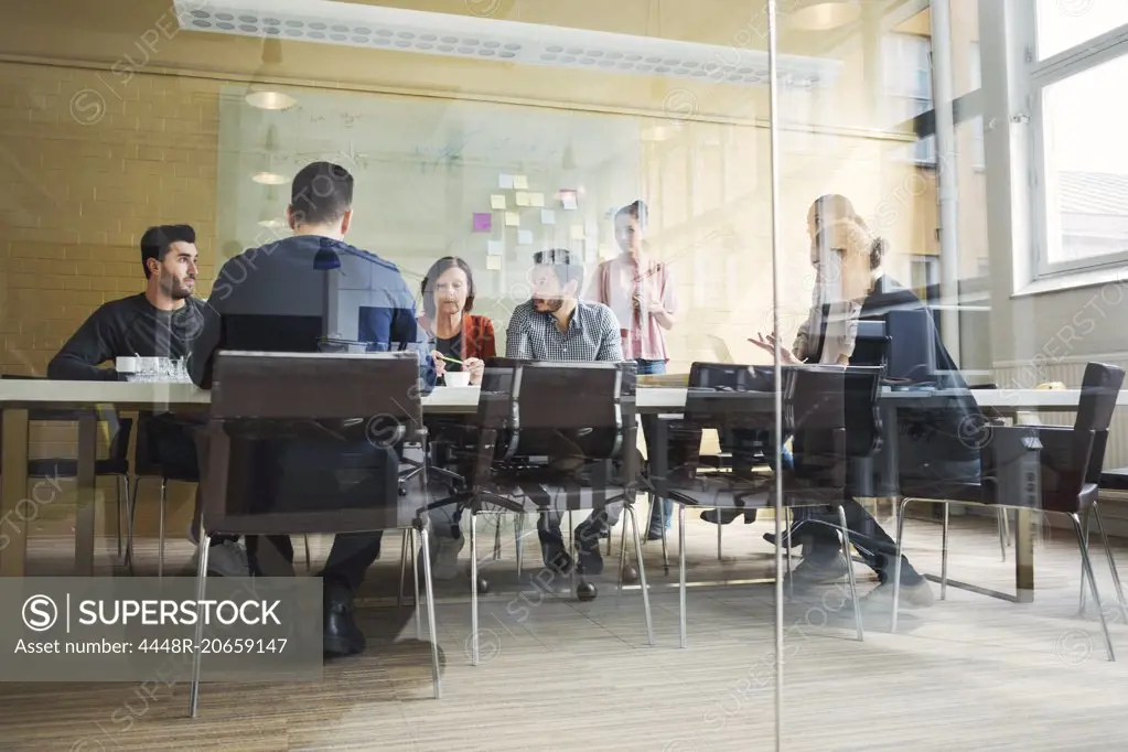 Multi-ethnic business people having discussion in conference room