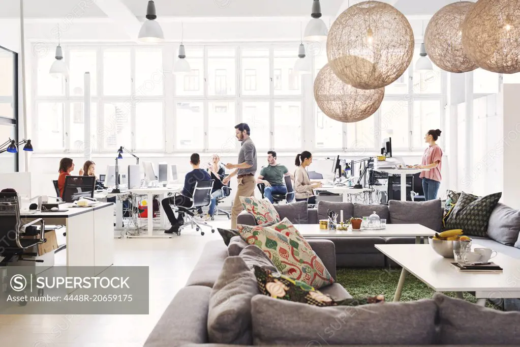 Modern office lobby with business people working in background