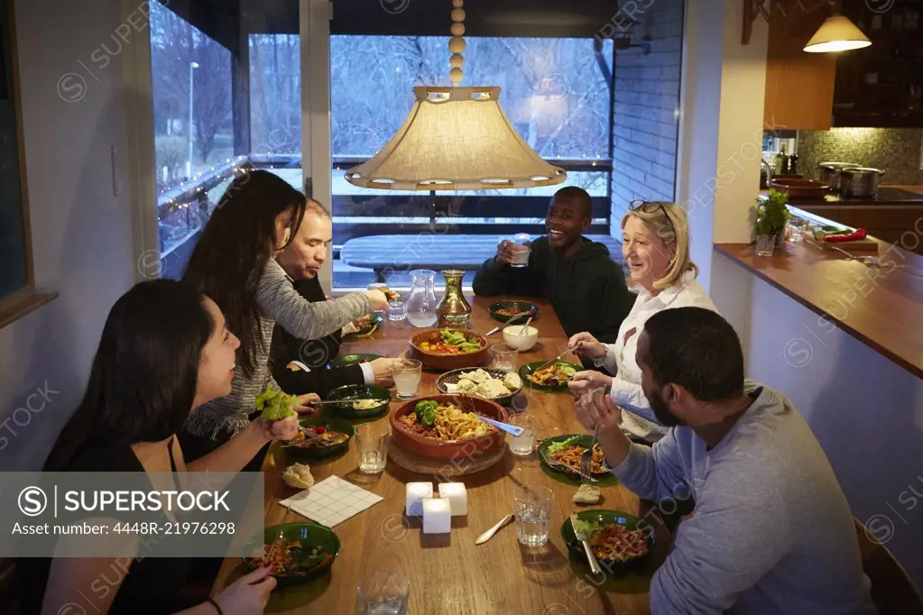 High angle view of multi-generation family enjoying meal at table