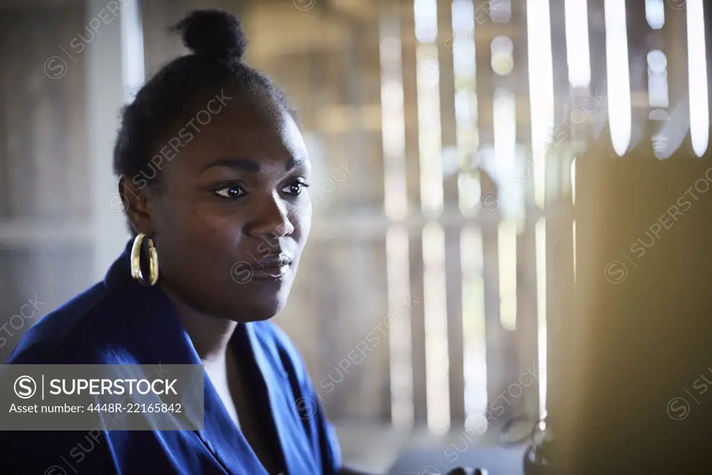 Serious businesswoman working in creative office